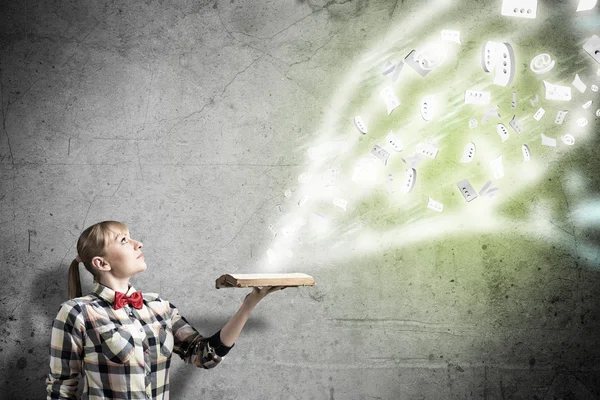 Girl with book in hands — Stock Photo, Image