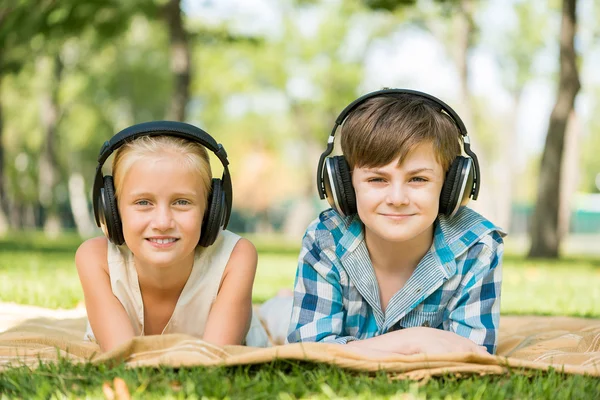 Kids wearing headphones — Stock Photo, Image