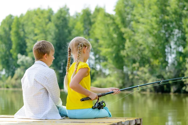 Boy and girl fishing — Stock Photo, Image