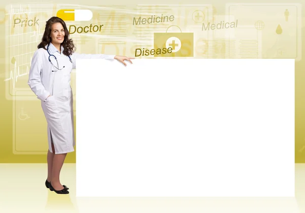 Young woman doctor near blank banner — Stock Photo, Image