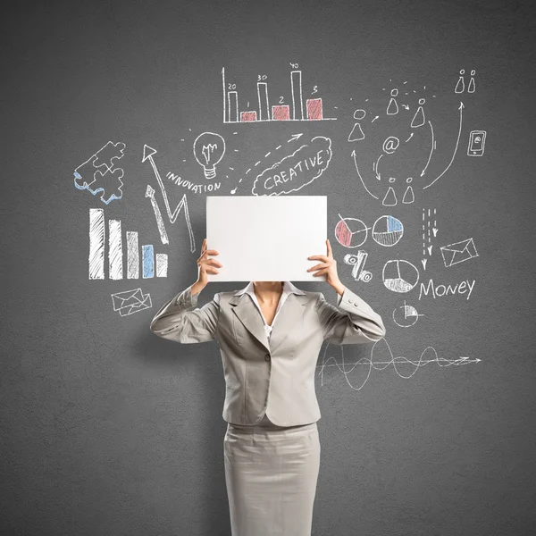 Businesswoman hiding face behind banner — Stock Photo, Image