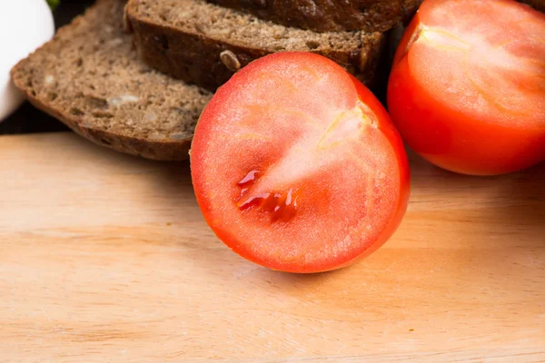 Vegetables and bread on table — Stock Photo, Image