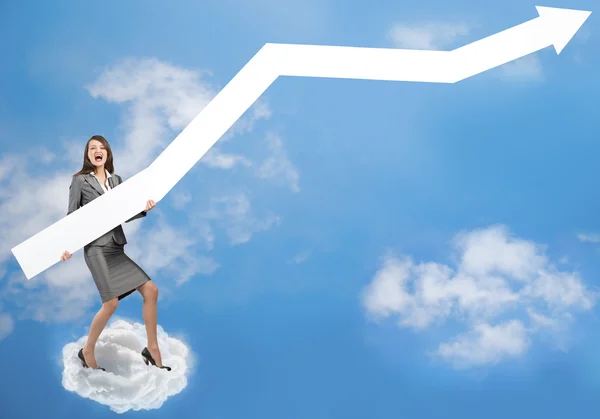 Businesswoman with arrow on cloud — Stock Photo, Image