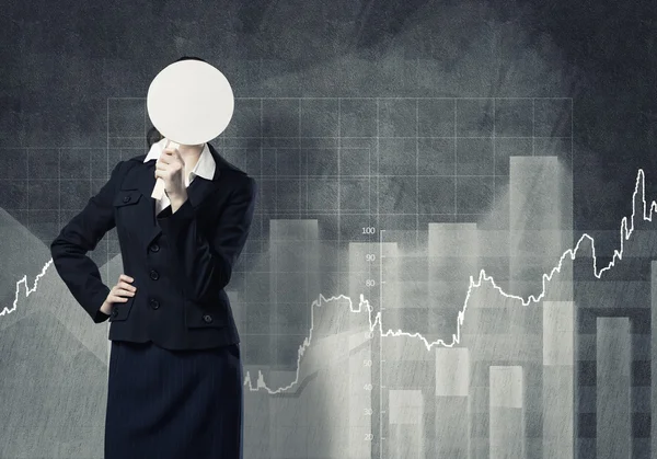 Businesswoman hiding face behind mask — Stock Photo, Image