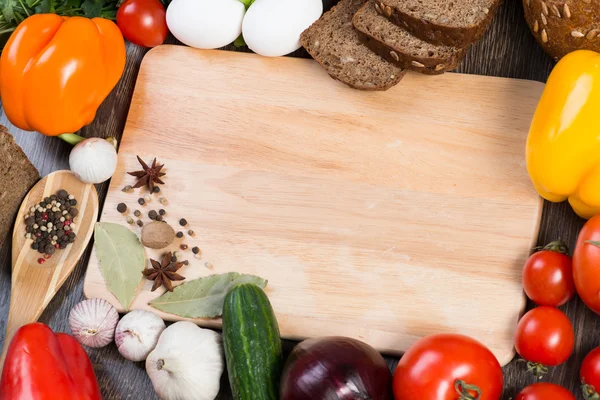 Vegetables and spices on kitchen table — Stock Photo, Image