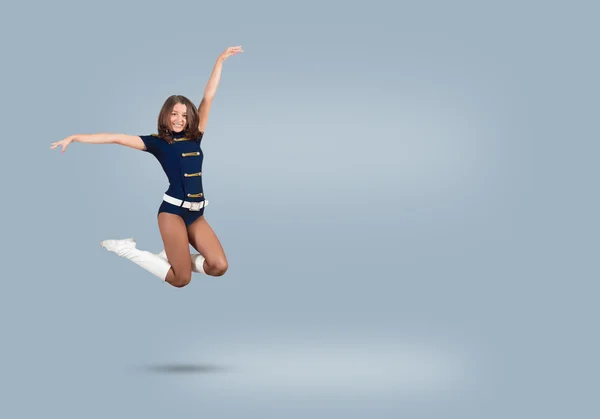 Cheerleader girl jumping high — Stock Photo, Image