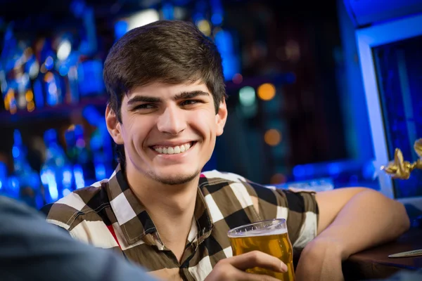 Young man at the bar — Stock Photo, Image