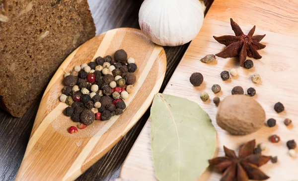 Vegetables and spices on kitchen table Stock Image