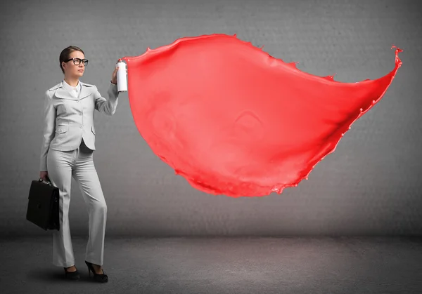 Businesswoman using spray — Stock Photo, Image