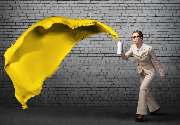 Businesswoman using spray — Stock Photo, Image