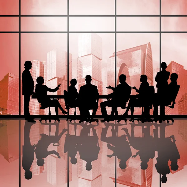 Businessteam sitting round table — Stock Photo, Image