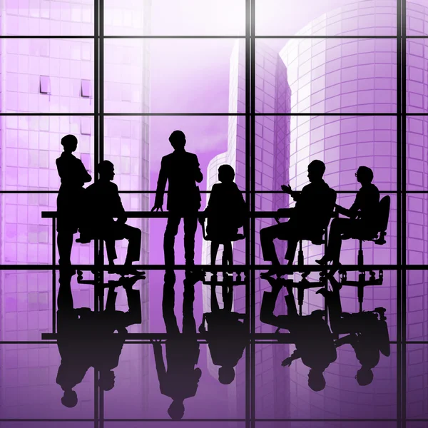 Businessteam sitting round table — Stock Photo, Image