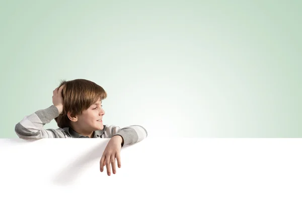 Boy with blank advertising board — Stock Photo, Image