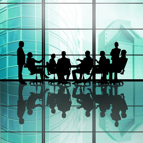 Geschäftsteam sitzt am runden Tisch — Stockfoto