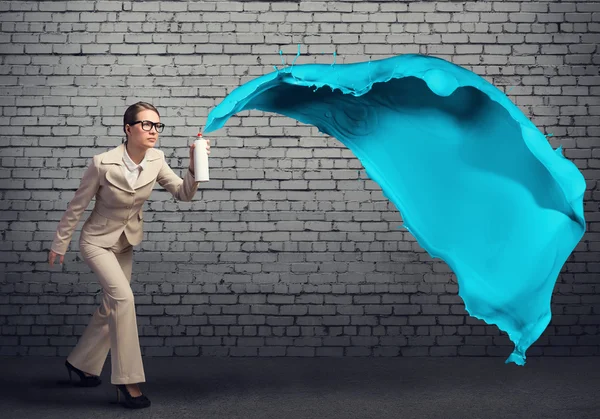 Businesswoman using spray — Stock Photo, Image