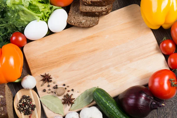 Vegetables and spices on kitchen table — Stock Photo, Image