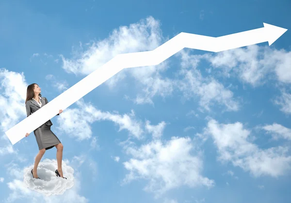 Businesswoman with arrow on cloud — Stock Photo, Image