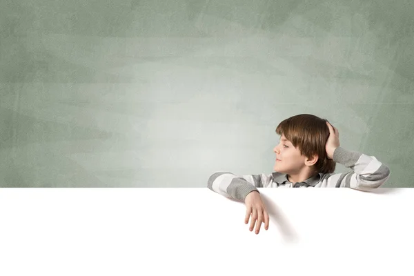 Boy with blank advertising board — Stock Photo, Image