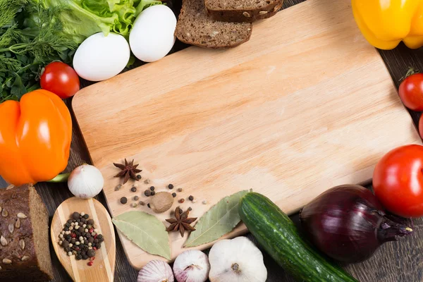 Vegetables and spices on kitchen table — Stock Photo, Image