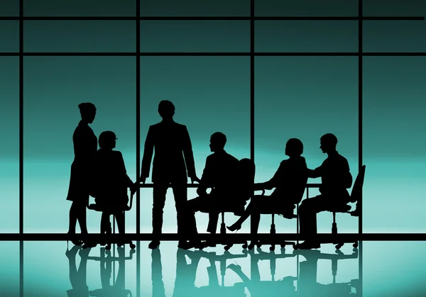 Businessteam sitting round table — Stock Photo, Image