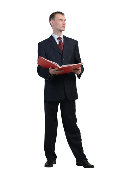 Businessman reading red book — Stock Photo, Image