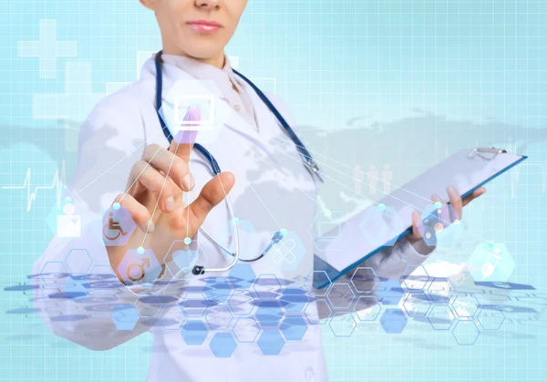 Young female doctor touching icon — Stock Photo, Image