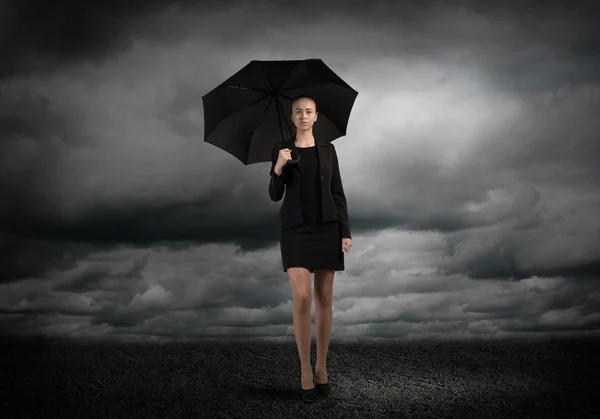 Young businesswoman with umbrella — Stock Photo, Image