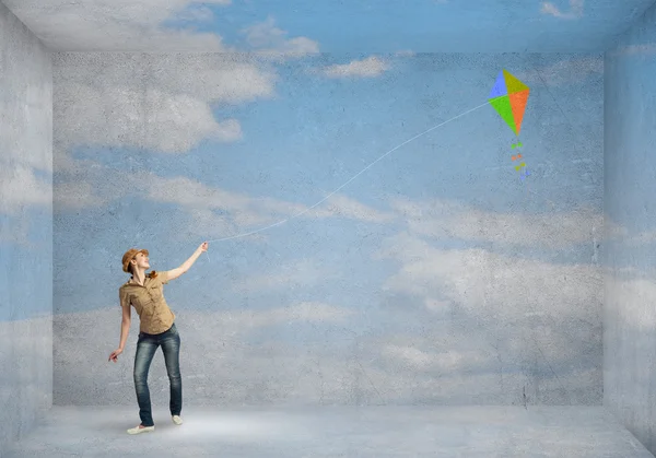 Girl playing with flying kite — Stock Photo, Image