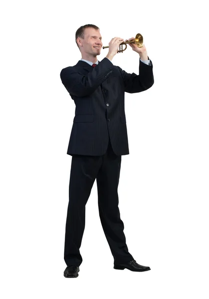 Businessman plays fife — Stock Photo, Image