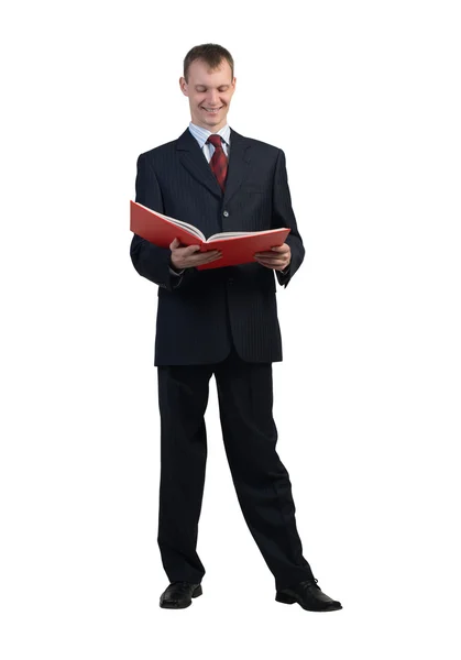 Businessman reading red book Stock Photo