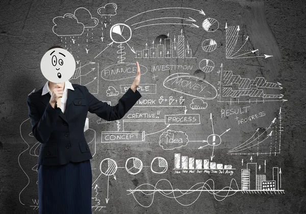 Businesswoman hiding her face behind mask — Stock Photo, Image