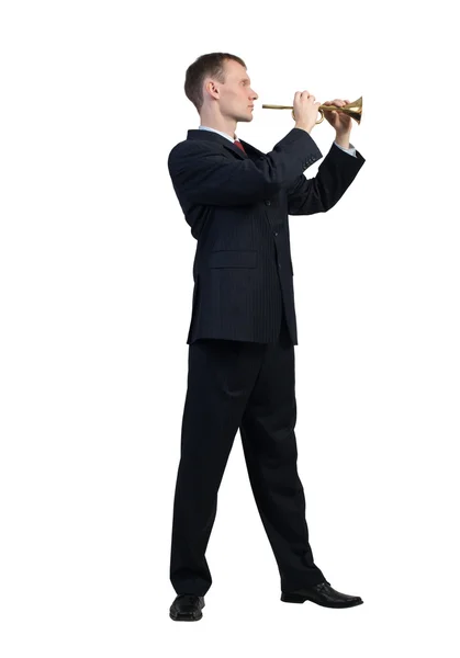 Businessman plays fife — Stock Photo, Image
