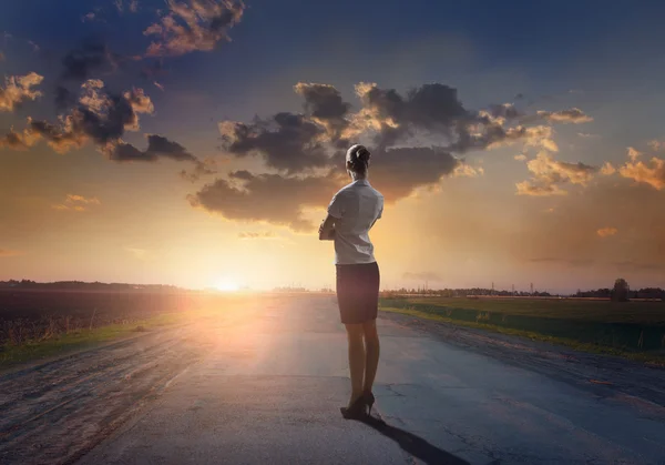 Young businesswoman standing on road to success — Stock Photo, Image