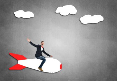 genç işadamı gökte uçan