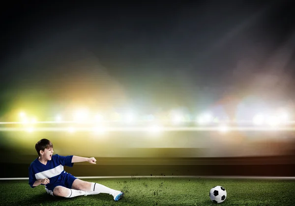 Kid boy kicking soccer ball — Stock Photo, Image