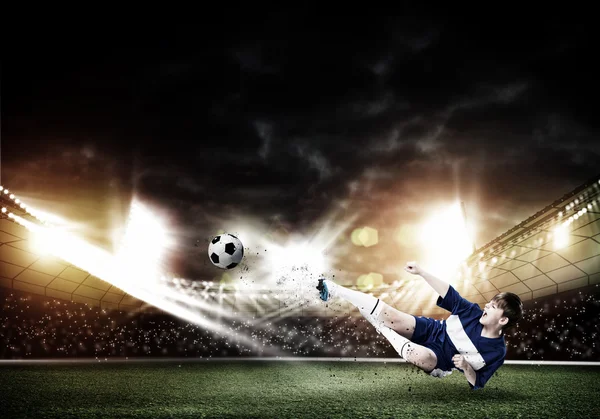 Kid boy kicking soccer ball — Stock Photo, Image