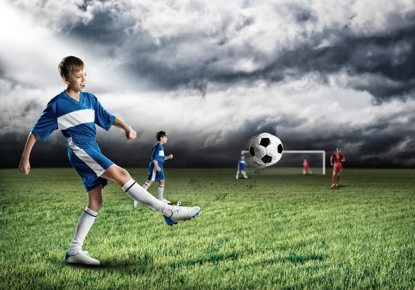 Boy football player at stadium — Stock Photo, Image