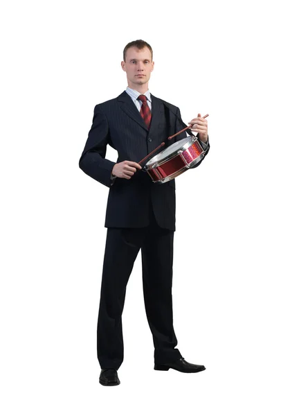 Businessman playing drums — Stock Photo, Image