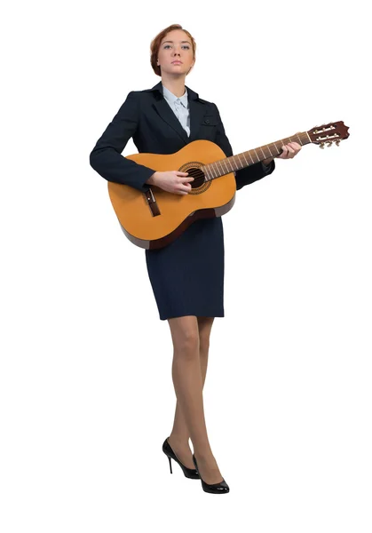 Cheerful businesswoman playing acoustic guitar — Stockfoto