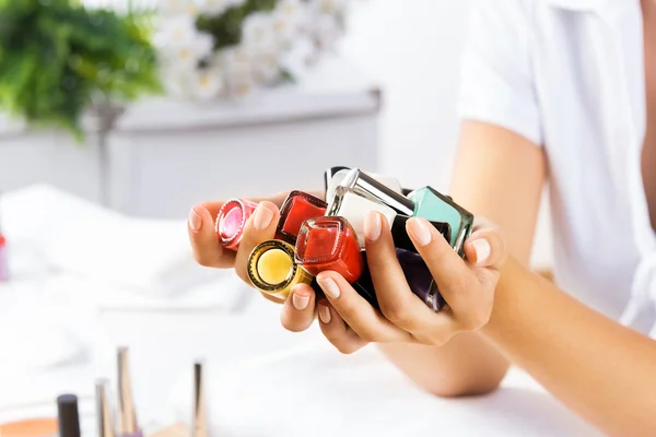 Woman hands with nail polishes — Stock Photo, Image