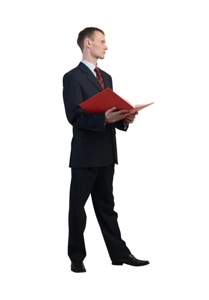 Businessman reading red book — Stock Photo, Image