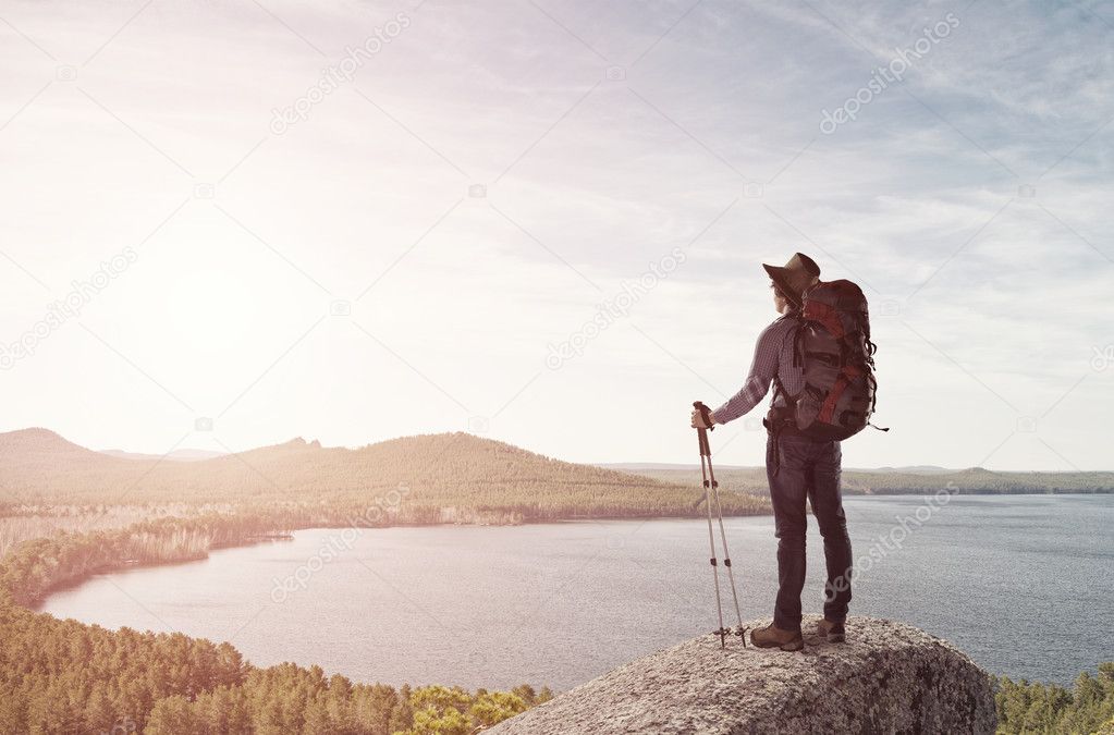 Young man hiker walking