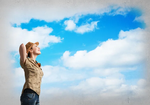 Girl in casual on clouds background — Stock Photo, Image