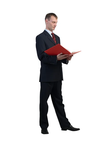 Empresario leyendo libro rojo — Foto de Stock