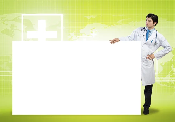 Doctor con banner en blanco — Foto de Stock