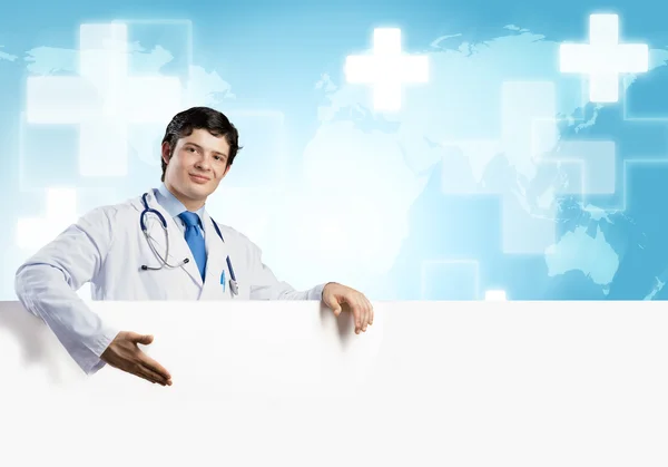 Doctor holding blank banner — Stock Photo, Image