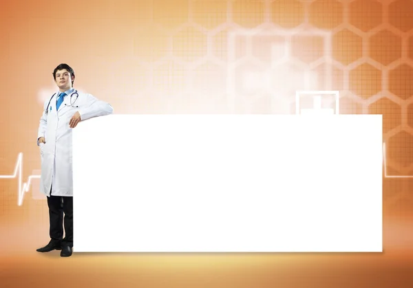 Doctor with blank banner — Stock Photo, Image