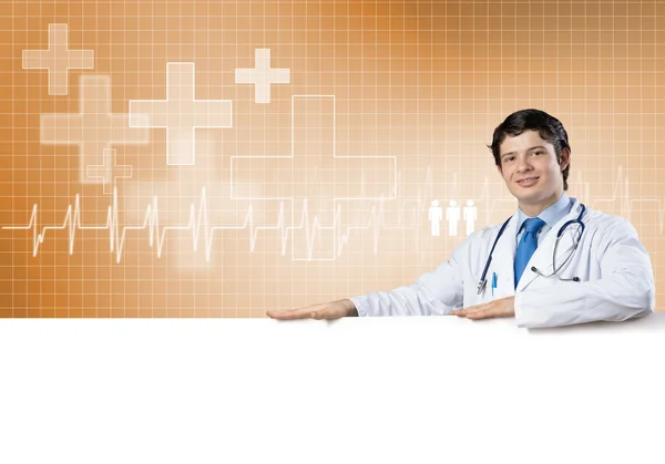 Doctor holding blank banner — Stock Photo, Image