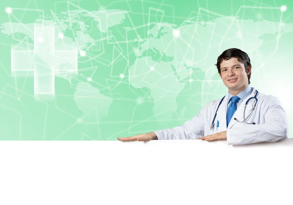 Doctor holding blank banner — Stock Photo, Image