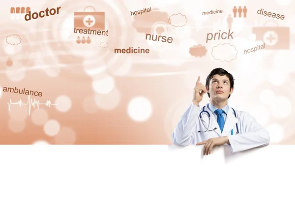 Doctor holding blank banner — Stock Photo, Image